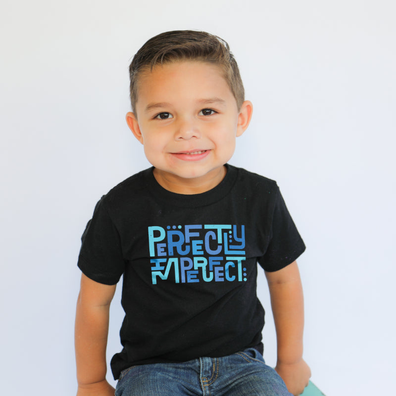 Boy wearing perfectly imperfect tee in black