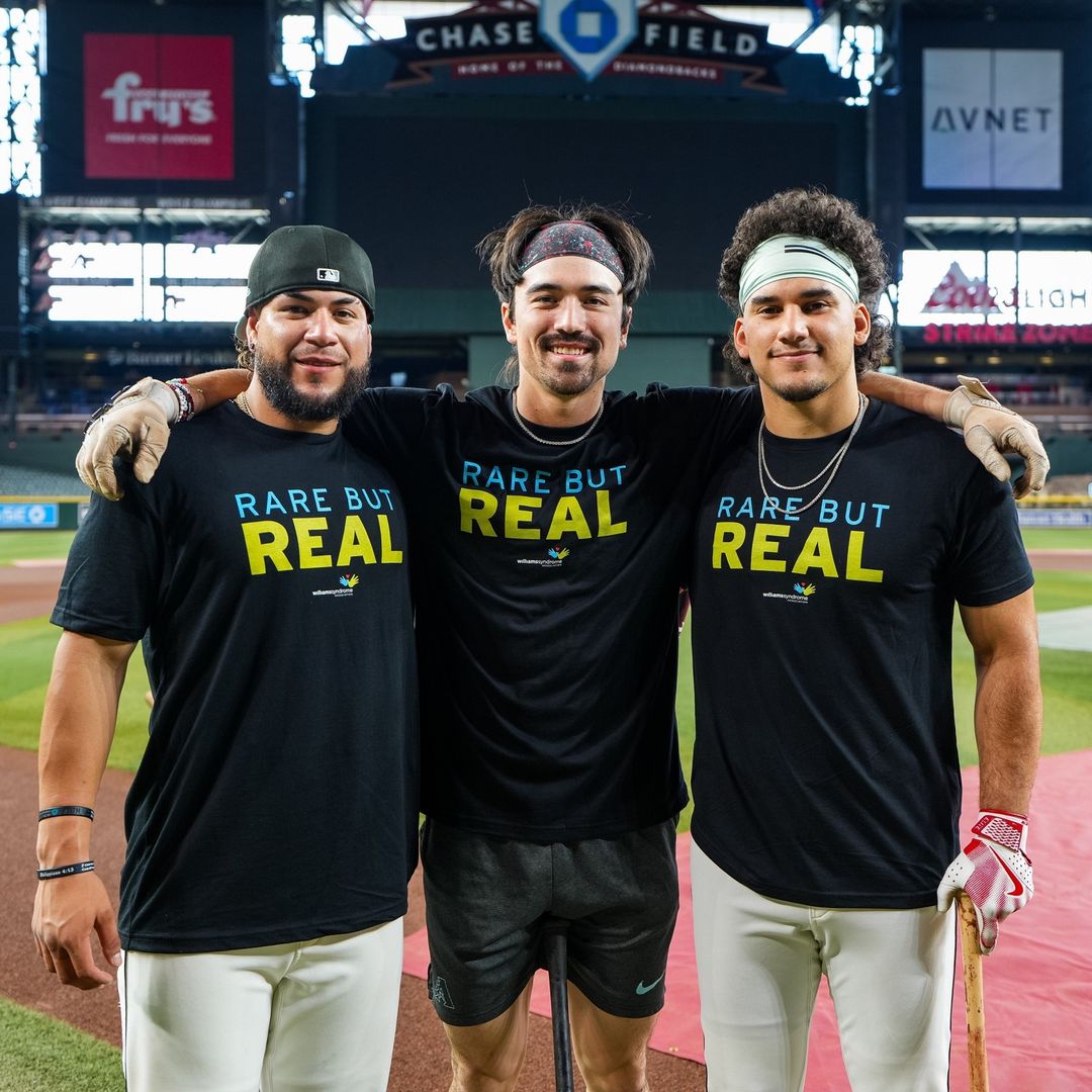 Arizona Diamondbacks™ players Jose Herrera, Corbin Carroll, and  Alek Thomas wearing Rare But Real T-Shirts to support Williams Syndrome Awareness.