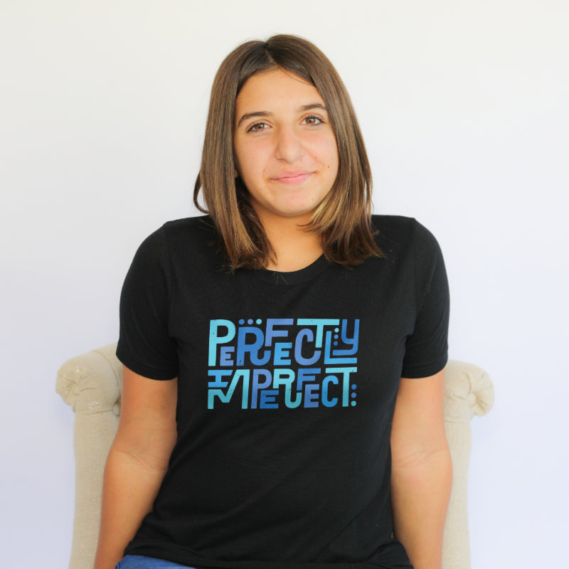 Woman wearing relaxed fit perfectly imperfect tee in black