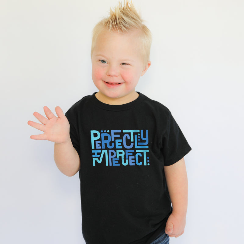 boy with down syndrome wears perfectly imperfect tee in black