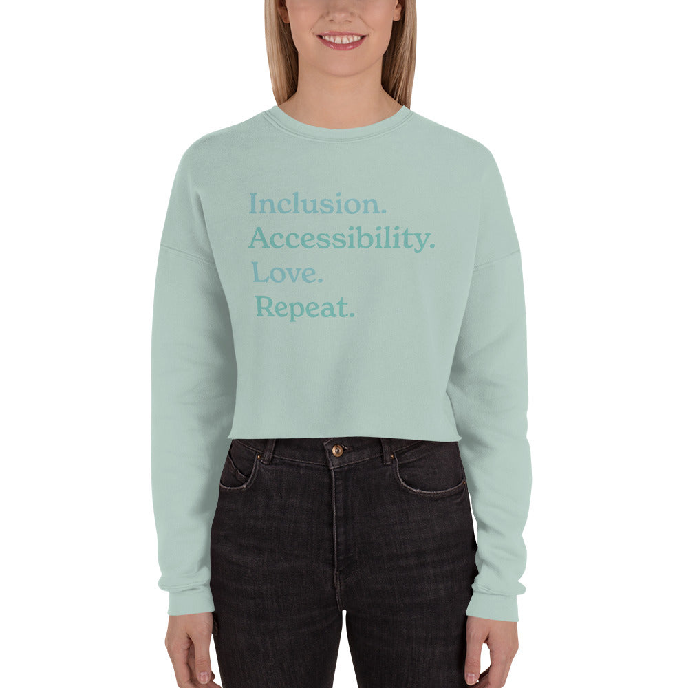 Inclusion. Accessibility. Love. Repeat. — Crop Sweatshirt